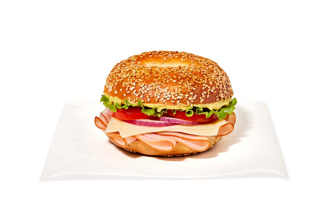 ham and swiss sandwich on a sesame bagel
